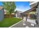 Secluded backyard featuring a shed, a patio with awning, and landscaped elements at 8699 Garrison Ct, Arvada, CO 80005