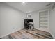 Bedroom area with built in shelves and wood-look flooring at 8699 Garrison Ct, Arvada, CO 80005