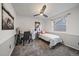 Bedroom with a work desk and accent wall at 8699 Garrison Ct, Arvada, CO 80005