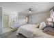 Bedroom featuring a closet and open doorway to the ensuite bathroom at 8699 Garrison Ct, Arvada, CO 80005