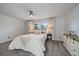 Cozy bedroom with a soft carpet, natural light, and comfortable bedding at 8699 Garrison Ct, Arvada, CO 80005