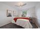 Comfortable bedroom with decorative bear art, soft lighting, and plush carpeting at 8699 Garrison Ct, Arvada, CO 80005