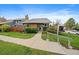 Well-maintained home with mature landscaping and inviting curb appeal at 8699 Garrison Ct, Arvada, CO 80005