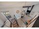 Expansive foyer with hardwood floors, staircase, and modern chandelier at 8699 Garrison Ct, Arvada, CO 80005