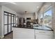 Eat-in kitchen features modern appliances, stylish countertops, and large window at 8699 Garrison Ct, Arvada, CO 80005