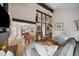 Spacious living room showcasing an open floor plan, a fireplace, and seamless flow to dining area at 8699 Garrison Ct, Arvada, CO 80005