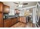 Modern kitchen featuring dark wood cabinets and granite countertops at 11012 Blackwolf Ln, Parker, CO 80138