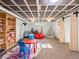 Finished basement with a play area including a teepee and colorful furniture at 1528 Holly St, Denver, CO 80220