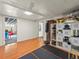 Finished basement area with workout area, playroom, and storage at 1528 Holly St, Denver, CO 80220