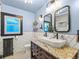 Stylish bathroom with modern fixtures, unique vanity, and eye-catching tile work at 1528 Holly St, Denver, CO 80220