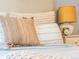 Bedroom featuring close up of pillows, bedside table, and lamp at 1528 Holly St, Denver, CO 80220