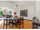 Dining room with modern chandelier and hardwood floors at 1528 Holly St, Denver, CO 80220