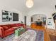 Open concept living space with seamless transition to dining area, perfect for entertaining at 1528 Holly St, Denver, CO 80220