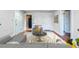 Bright living room featuring hardwood floors, a neutral color palette, and modern furnishings at 700 E Ellsworth Ave # 2, Denver, CO 80209