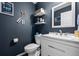 Nautical-themed bathroom featuring modern fixtures, stylish decor, and unique wall accents at 1464 Nemrick Pl, Castle Rock, CO 80109
