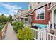Charming townhouse features a cozy front patio with comfortable seating and a fire pit, perfect for outdoor enjoyment at 1464 Nemrick Pl, Castle Rock, CO 80109
