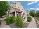 Charming townhome with a well-maintained yard, white picket fence, and inviting curb appeal at 1464 Nemrick Pl, Castle Rock, CO 80109