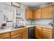 Kitchen with stainless steel appliances, light countertops, and a view to the backyard at 1464 Nemrick Pl, Castle Rock, CO 80109