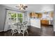Charming kitchen and dining area with wood cabinets, large windows, and modern appliances at 1464 Nemrick Pl, Castle Rock, CO 80109