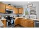 Charming kitchen with modern appliances, light countertops, and a view to the backyard at 1464 Nemrick Pl, Castle Rock, CO 80109