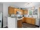 Cozy kitchen with wood cabinets, stainless steel appliances and plenty of counter space at 1464 Nemrick Pl, Castle Rock, CO 80109