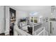 Bright living room with fireplace, TV, and large windows providing scenic views at 1464 Nemrick Pl, Castle Rock, CO 80109