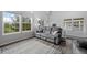 Bright and airy living room with large windows, comfortable sofa, and modern decor at 1464 Nemrick Pl, Castle Rock, CO 80109