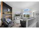 Cozy living room with fireplace, large windows, and comfortable seating at 1464 Nemrick Pl, Castle Rock, CO 80109