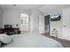 Bright primary bedroom featuring en-suite bath, desk and TV at 1464 Nemrick Pl, Castle Rock, CO 80109