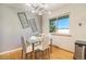 Charming breakfast nook with a glass table, natural light, and scenic backyard views at 8895 E Radcliff E Ave, Denver, CO 80237