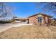 Charming brick home featuring a well-manicured front yard and inviting entrance at 8895 E Radcliff E Ave, Denver, CO 80237
