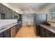 Modern kitchen with updated appliances, ample counter space, and an adjacent dining area at 8895 E Radcliff E Ave, Denver, CO 80237