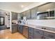 Well-appointed kitchen with stainless steel appliances, sleek cabinetry, and modern countertops at 8895 E Radcliff E Ave, Denver, CO 80237