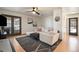 Cozy living room with stylish furniture, hardwood floors, and ample natural light at 8895 E Radcliff E Ave, Denver, CO 80237