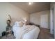 Cozy bedroom features neutral tones, plush carpet, and a comfortable bed, creating a peaceful retreat at 11250 Florence St # 17D, Commerce City, CO 80640