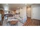 Bright living space features an open floor plan and stylish decor, flowing into the dining area and kitchen at 11250 Florence St # 17D, Commerce City, CO 80640