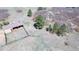 A bird's-eye view of the property showcases an outbuilding and surrounding natural landscape with trees and shrubs at 12984 Crowfoot Springs Rd, Larkspur, CO 80118