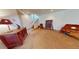 Open basement area with neutral walls, carpet, storage cabinets, and stairs at 12984 Crowfoot Springs Rd, Larkspur, CO 80118