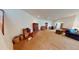Open basement area with neutral walls, carpet, and furniture at 12984 Crowfoot Springs Rd, Larkspur, CO 80118