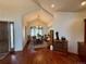 Open dining room featuring hardwood floors, a decorative chandelier, and large windows at 12984 Crowfoot Springs Rd, Larkspur, CO 80118