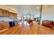 This living room boasts hardwood floors, large windows and doors, and a beautiful stone fireplace at 12984 Crowfoot Springs Rd, Larkspur, CO 80118
