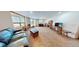 A spacious living room with a large window, comfortable seating, and natural light, perfect for relaxation at 12984 Crowfoot Springs Rd, Larkspur, CO 80118