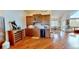Off the living room, this wet bar with wood cabinets and wine fridge offers a great gathering spot at 12984 Crowfoot Springs Rd, Larkspur, CO 80118