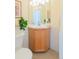 Small bathroom featuring vanity with wood cabinet and white tiled walls at 211 Rockview Dr, Superior, CO 80027