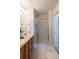 Bright bathroom featuring a vanity and enclosed shower with glass door at 211 Rockview Dr, Superior, CO 80027