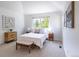 Bedroom with vaulted ceiling, white walls, window and soft natural light at 211 Rockview Dr, Superior, CO 80027