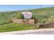 Stone monument sign reads: The Ridge at Superior, with grass and landscape features at 211 Rockview Dr, Superior, CO 80027