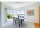 Cozy dining area featuring a table with four chairs and sliding glass doors to a patio at 211 Rockview Dr, Superior, CO 80027