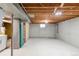 Unfinished basement area with exposed beams and concrete walls ready for customization at 5099 S Linden Dr, Englewood, CO 80110
