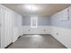 Partially finished basement with unique ceilings, white-paneled walls, and a window at 5099 S Linden Dr, Englewood, CO 80110